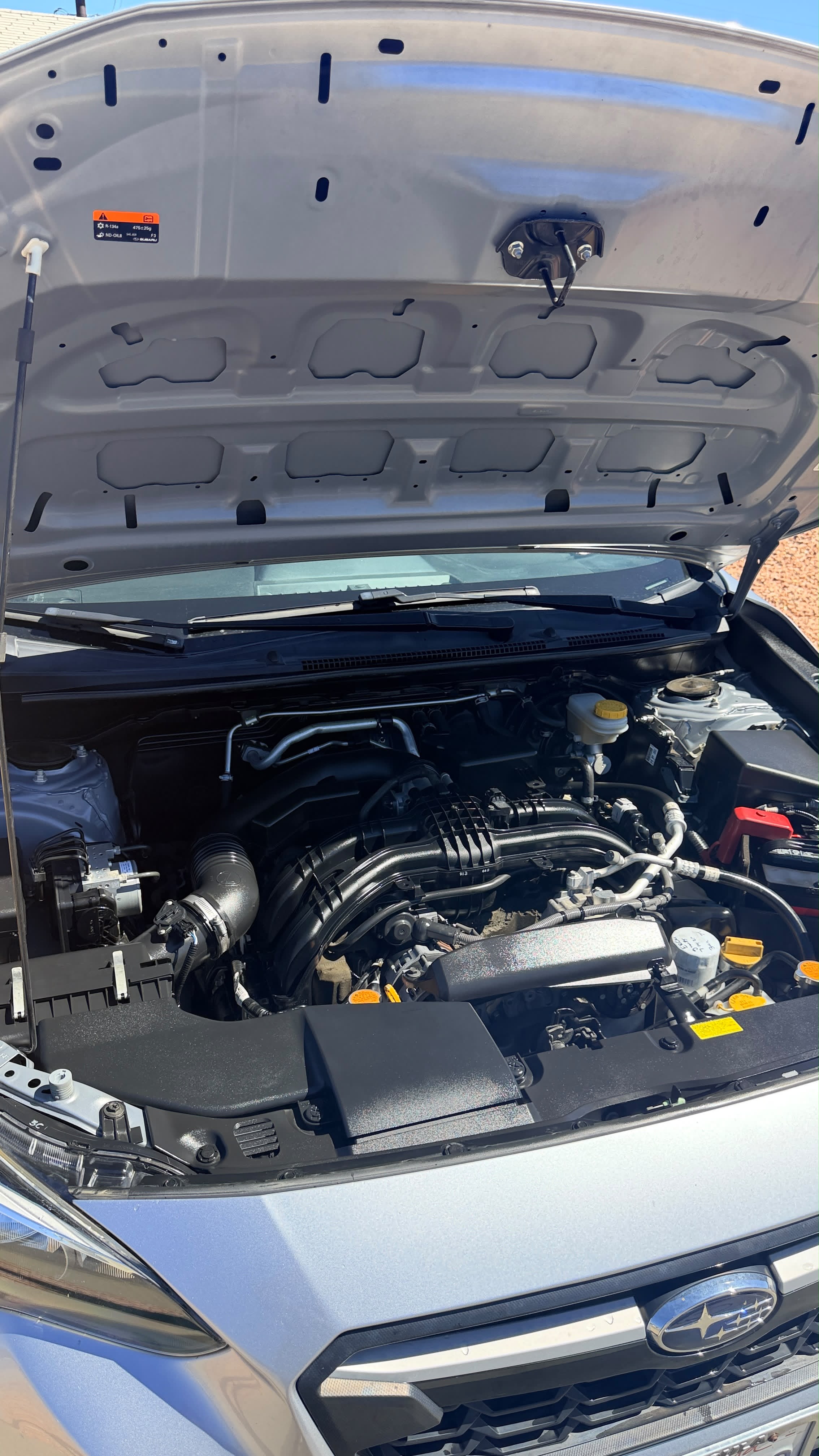 Engine bay cleaning in Riverside & San Diego County, degreased and dressed engine bay under an open hood