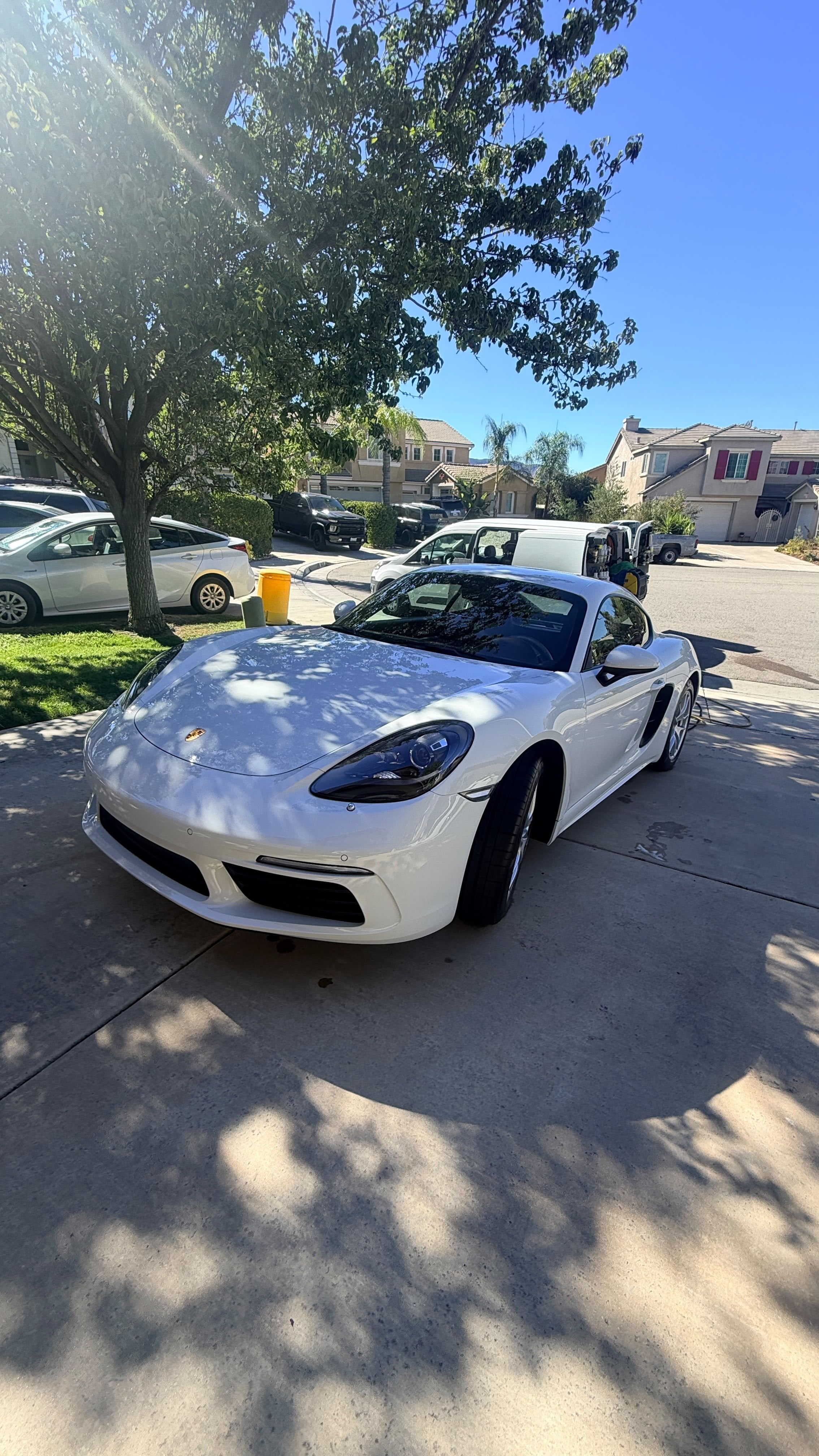 Mobile car detailing in Riverside & San Diego County, white sports coupe with a gloss finish, detailed in a residential driveway
